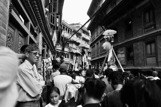 Crowded street scene during a vibrant cultural festival in Nepal.