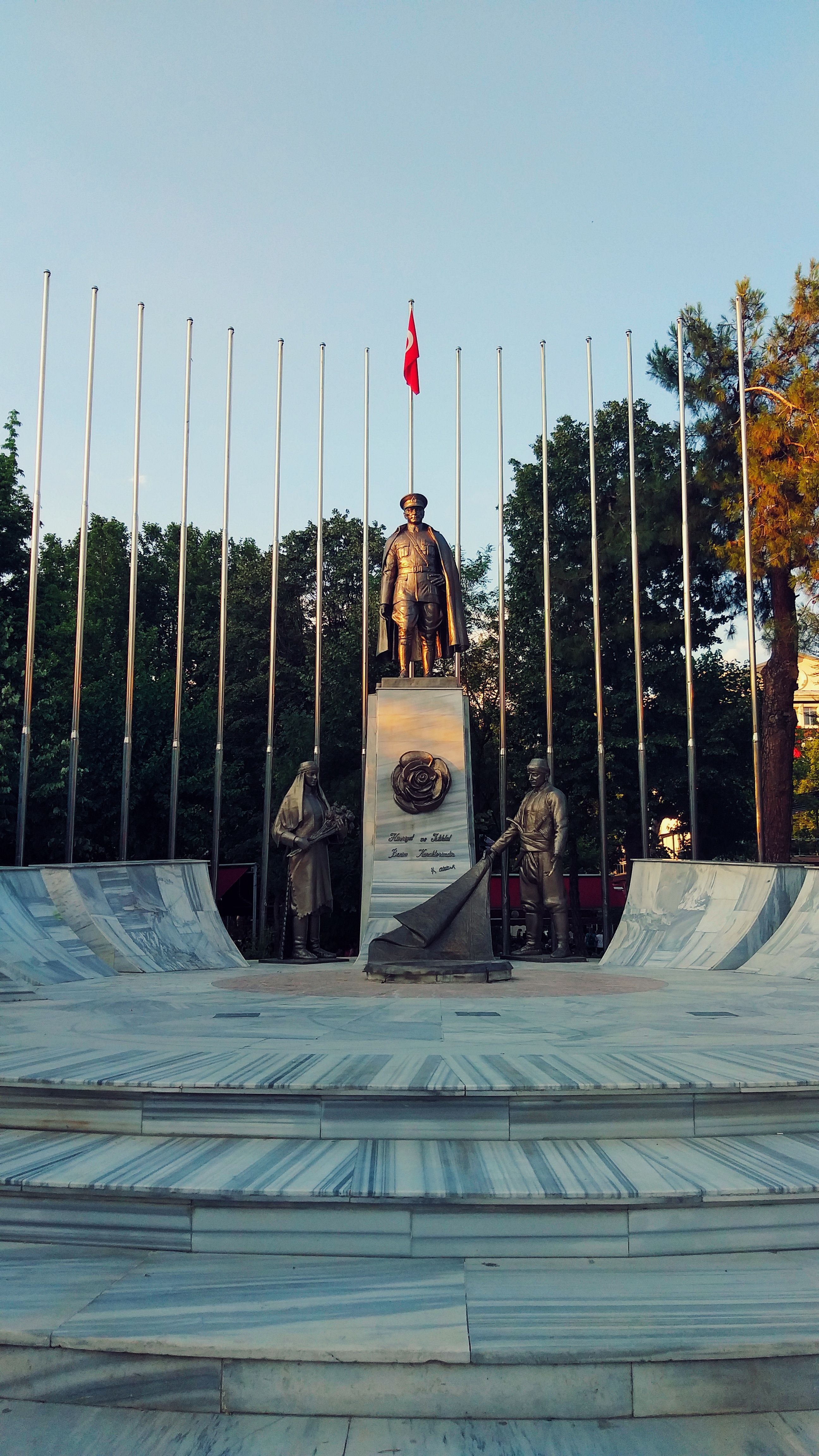 Statue of Mustafa Kemal Atatürk with Turkish flag in Isparta, Türkiye.