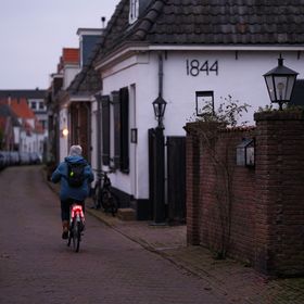 Cyclists riding together in low light — photo by Haberdoedas Photography on Pexels