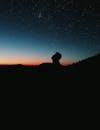 Silhouette Photo of Person Under Starry Sky