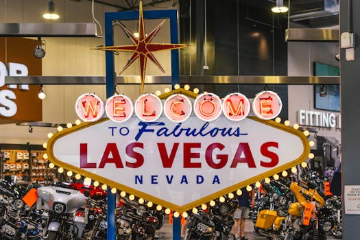 Harley Davidson store in Las Vegas featuring the famous Welcome to Las Vegas sign indoors, surrounded by motorcycles.