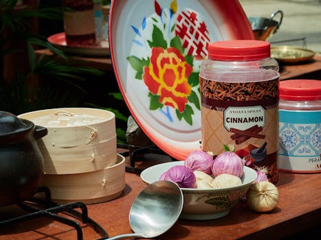 Vibrant arrangement of Asian cooking tools and ingredients on an outdoor kitchen setup, perfect for culinary themes.