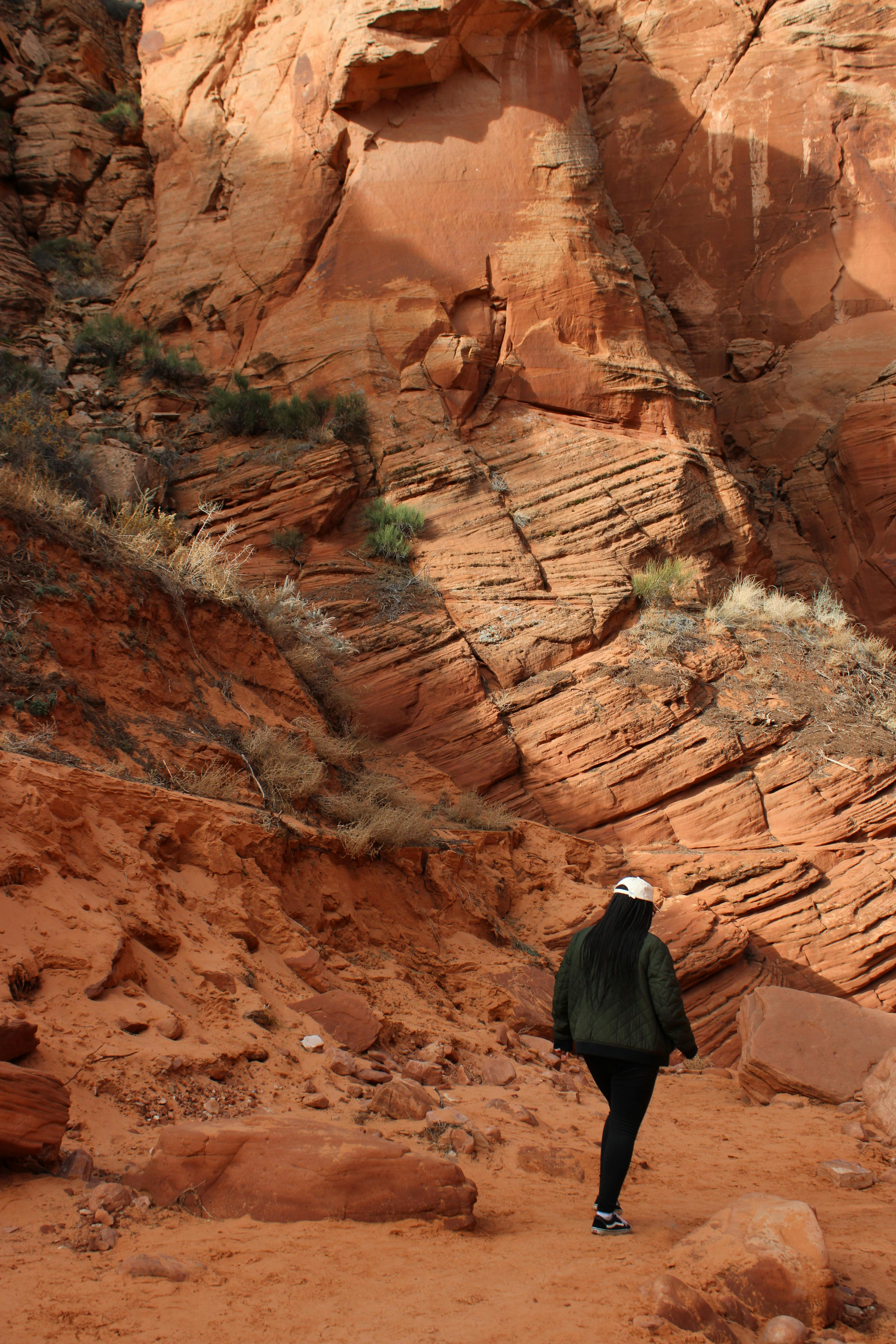 A person walks through the stunning red rock formations of Antelope Canyon, Arizona.