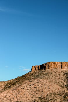 Stunning desert landscape in Arizona with clear blue sky and rocky formations.