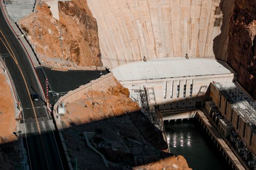 Free Stunning aerial perspective of the iconic Hoover Dam located on the border of Arizona and Nevada. Stock Photo