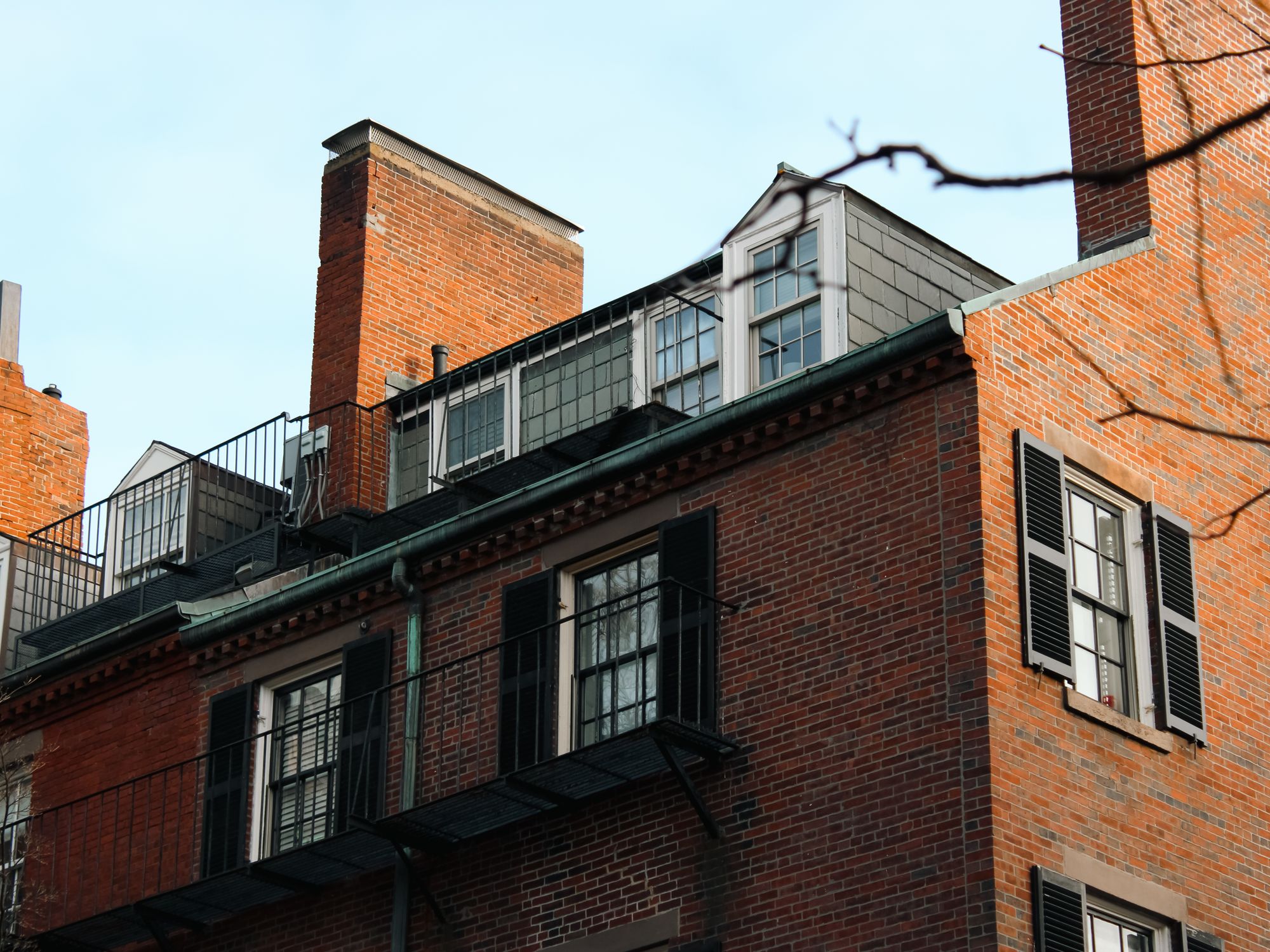 Exterior Painting in North Kensington, Kensington and Chelsea — painter refreshing a house exterior in weatherproof paint