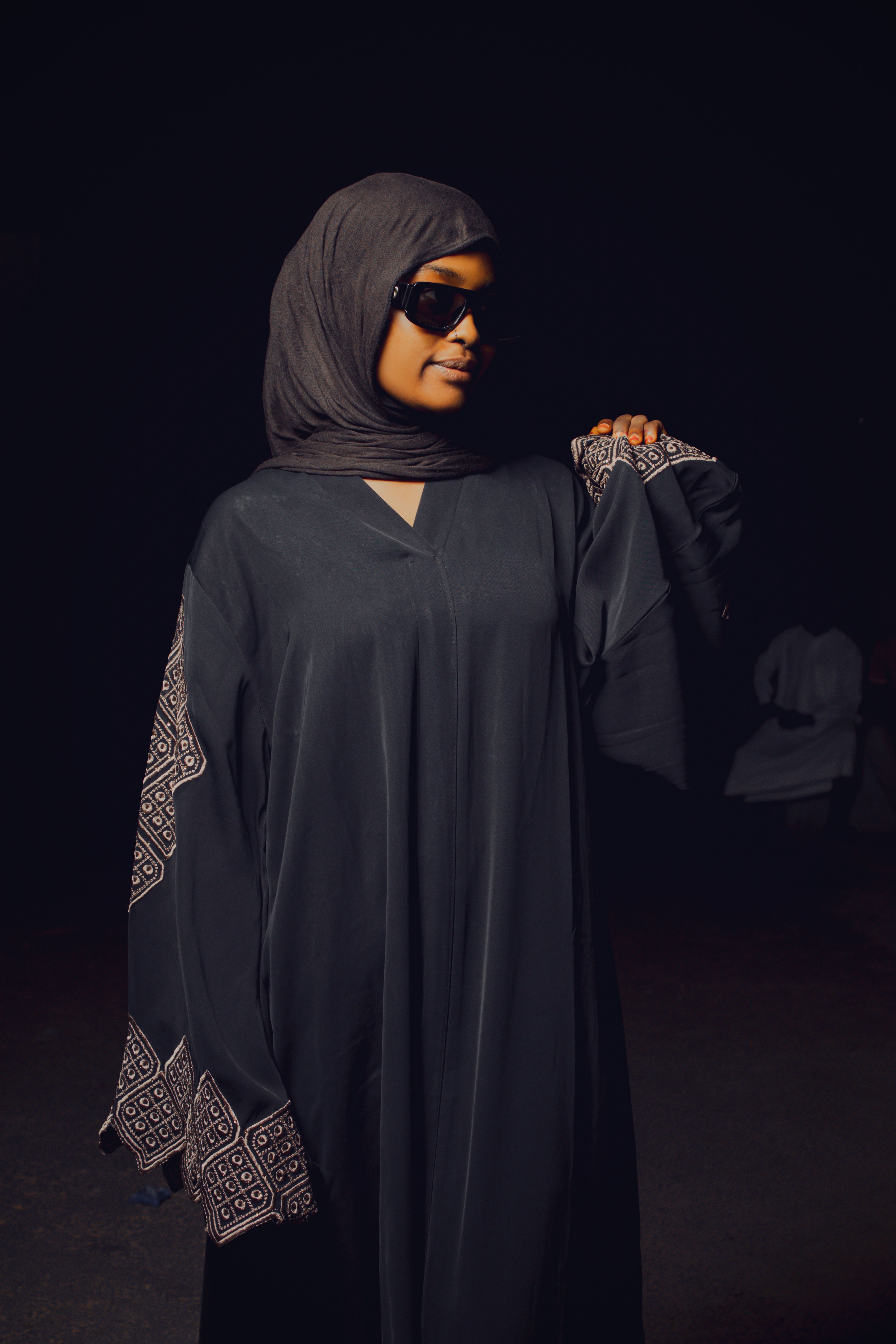 Woman wearing an elegant traditional abaya, representing our ladies abaya category