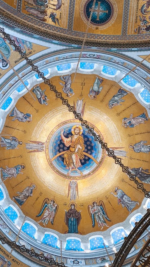 Free Intricate dome mosaic with religious figures in a cathedral. Stock Photo