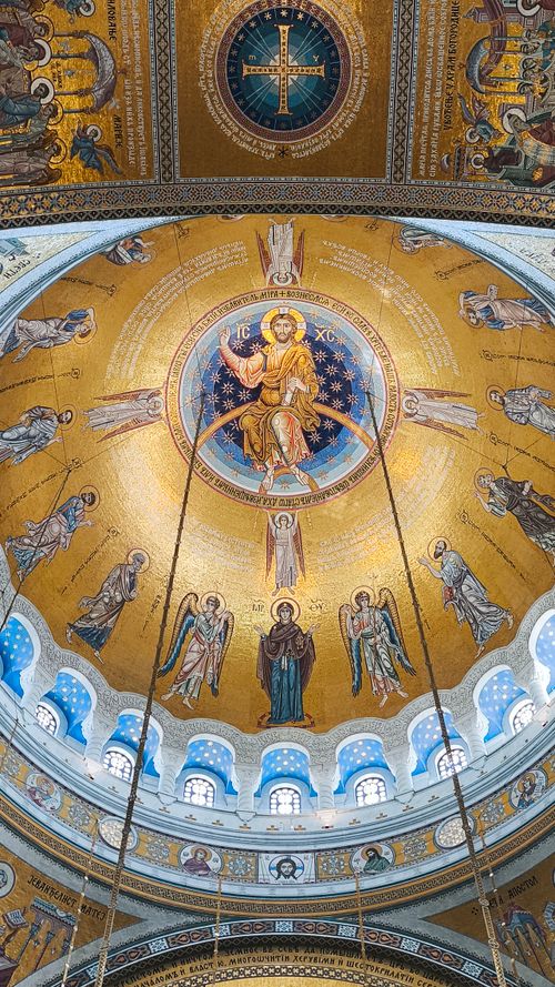 Free Intricate mosaic art of saints and angels in a cathedral dome. Stock Photo