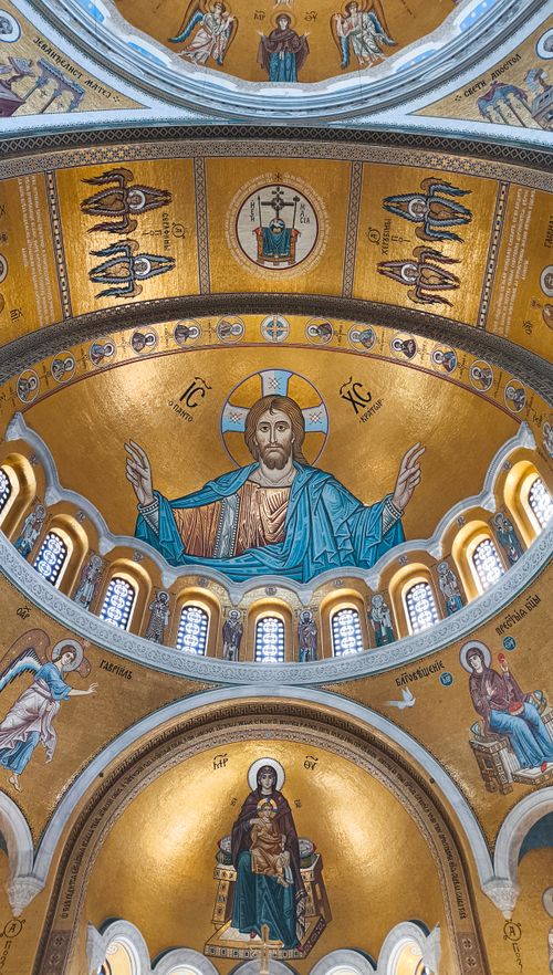 Free Intricate Byzantine church ceiling showcasing religious iconography and gold mosaics. Stock Photo