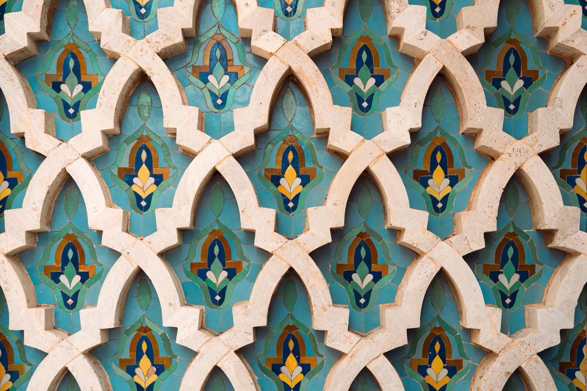 Detailed view of a colorful Moroccan tile pattern with geometric shapes and vibrant colors.