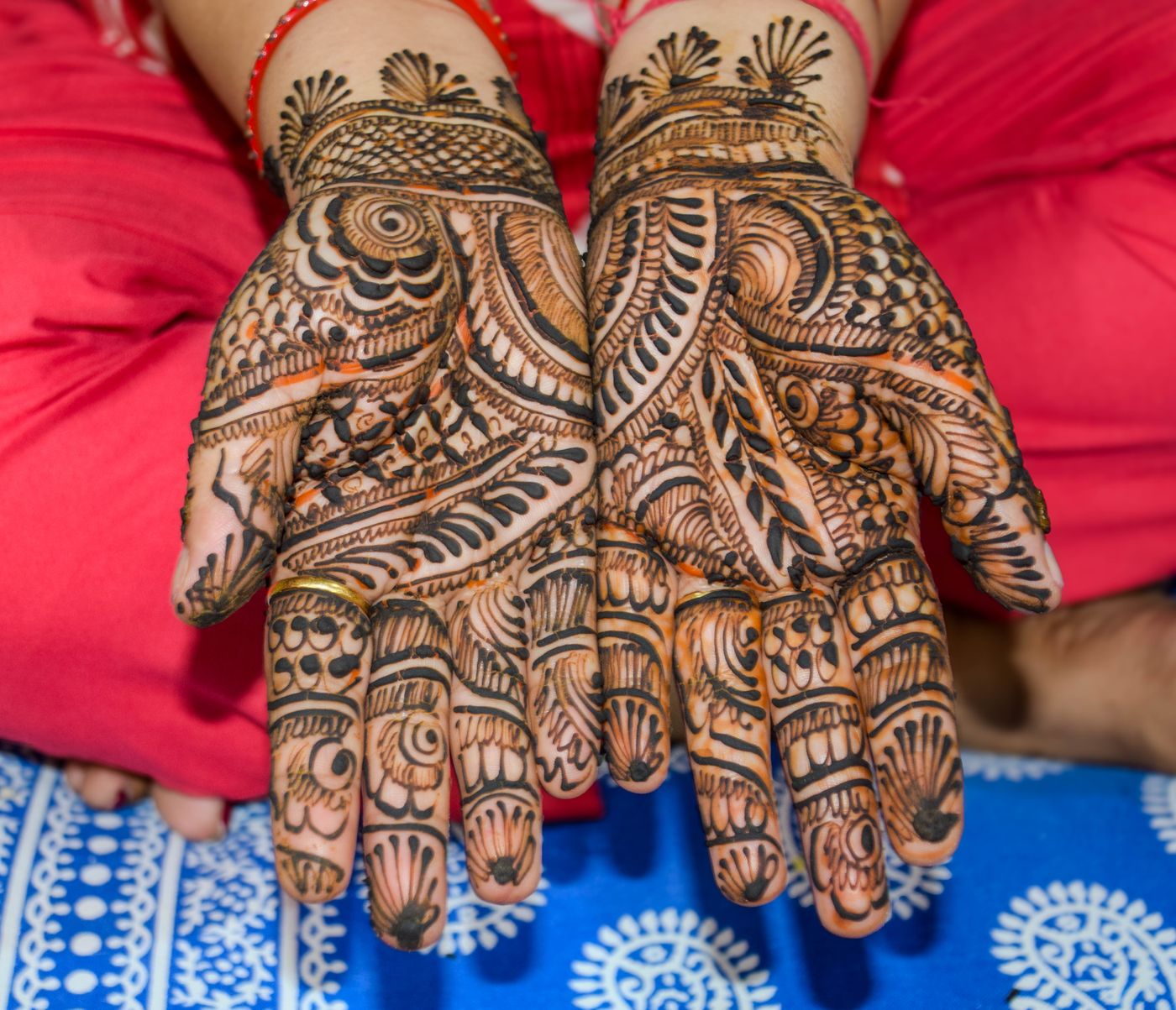 Intricate henna design on hands