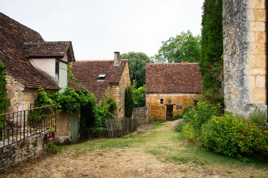 Rustic stone cottages in a serene Nouvelle-Aquitaine village, perfect for travel explorations.