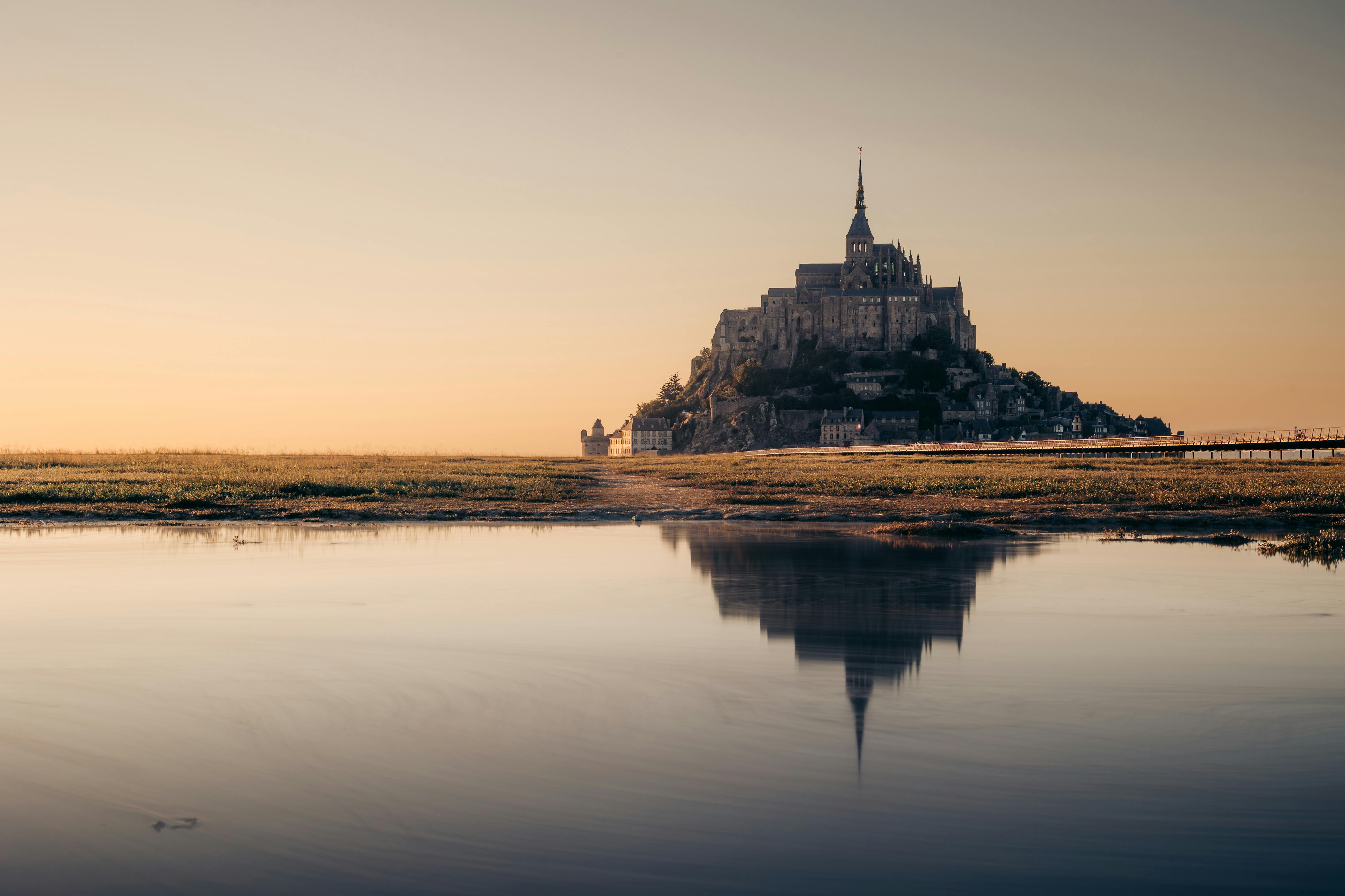 Majestic Mont Saint-Michel at Sunset Reflection · Free Stock Photo
