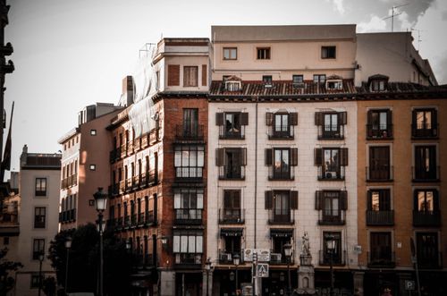 Free Classic European buildings with ornate facades, captured beautifully at sunset. Stock Photo