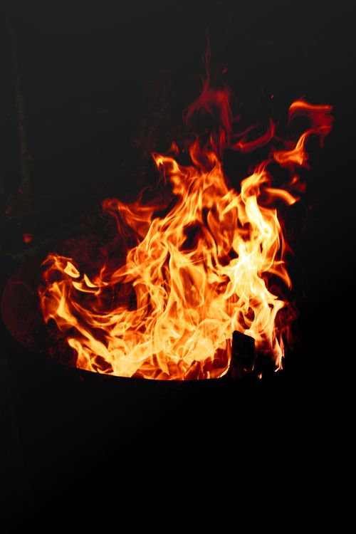 Vibrant Flames in Dark Setting · Free Stock Photo