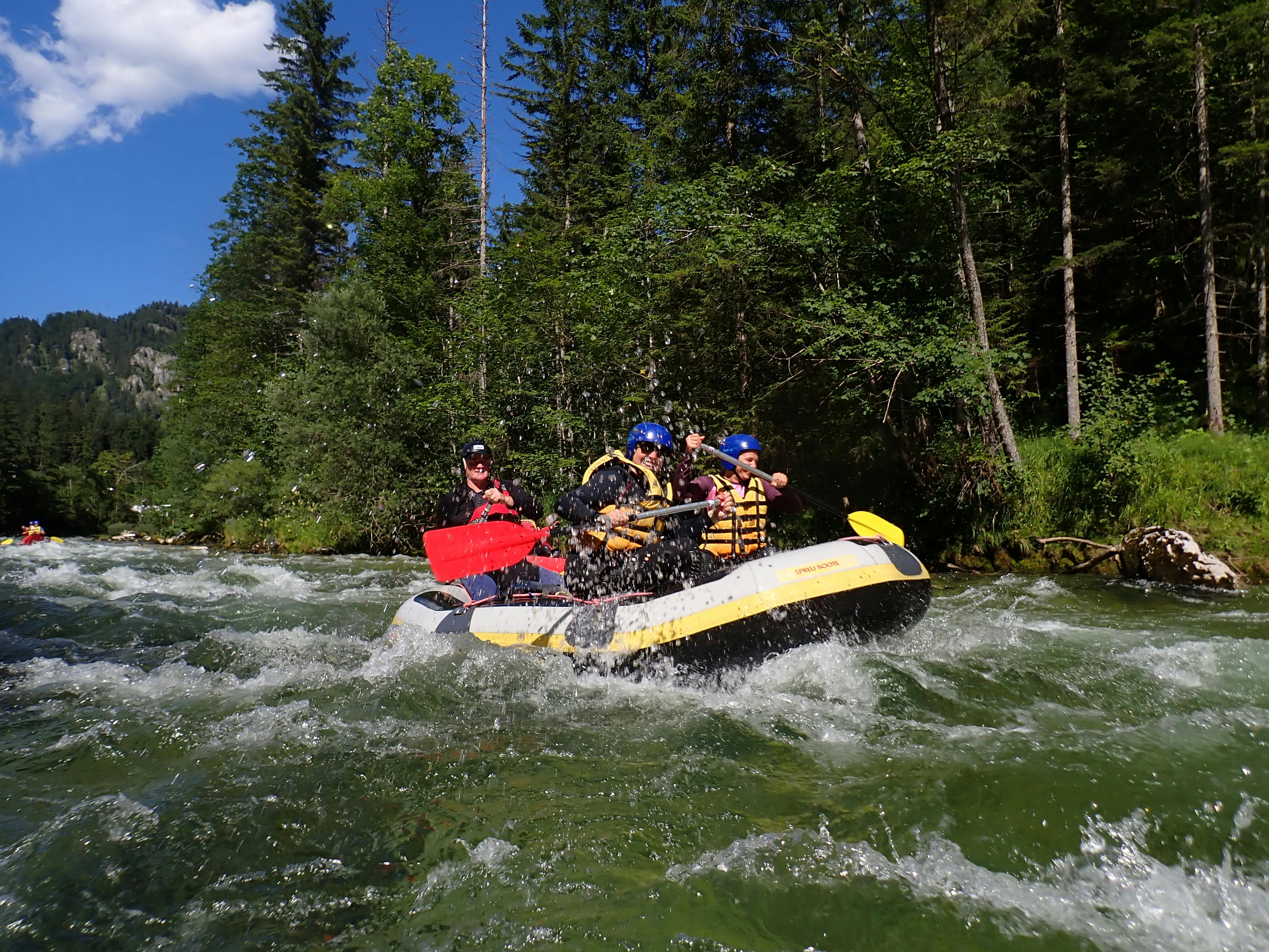 Rafters splashing through Class IV rapids on the Telaga Waja River with Mount Agung in the background, East Bali