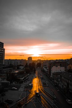 Scenic sunset view of Marseille, France with striking orange hues over the urban landscape.