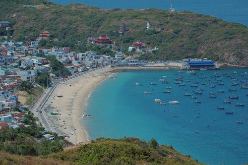 Free Aerial view of Quy Nhon beachfront with clear blue waters and sandy beach. Stock Photo