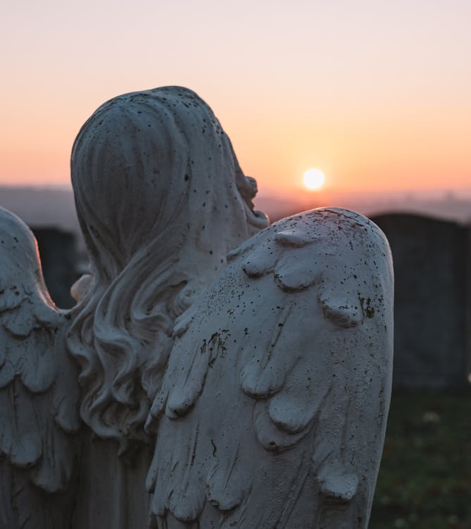 Free Angelic Statue and Sunset Scenery Stock Photo