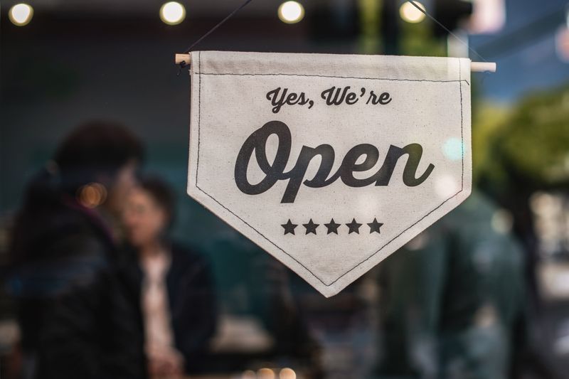 Open sign in a storefront door