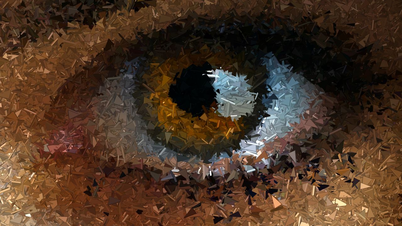 a close up abstract depiction of an eye using a mosaic of triangular s