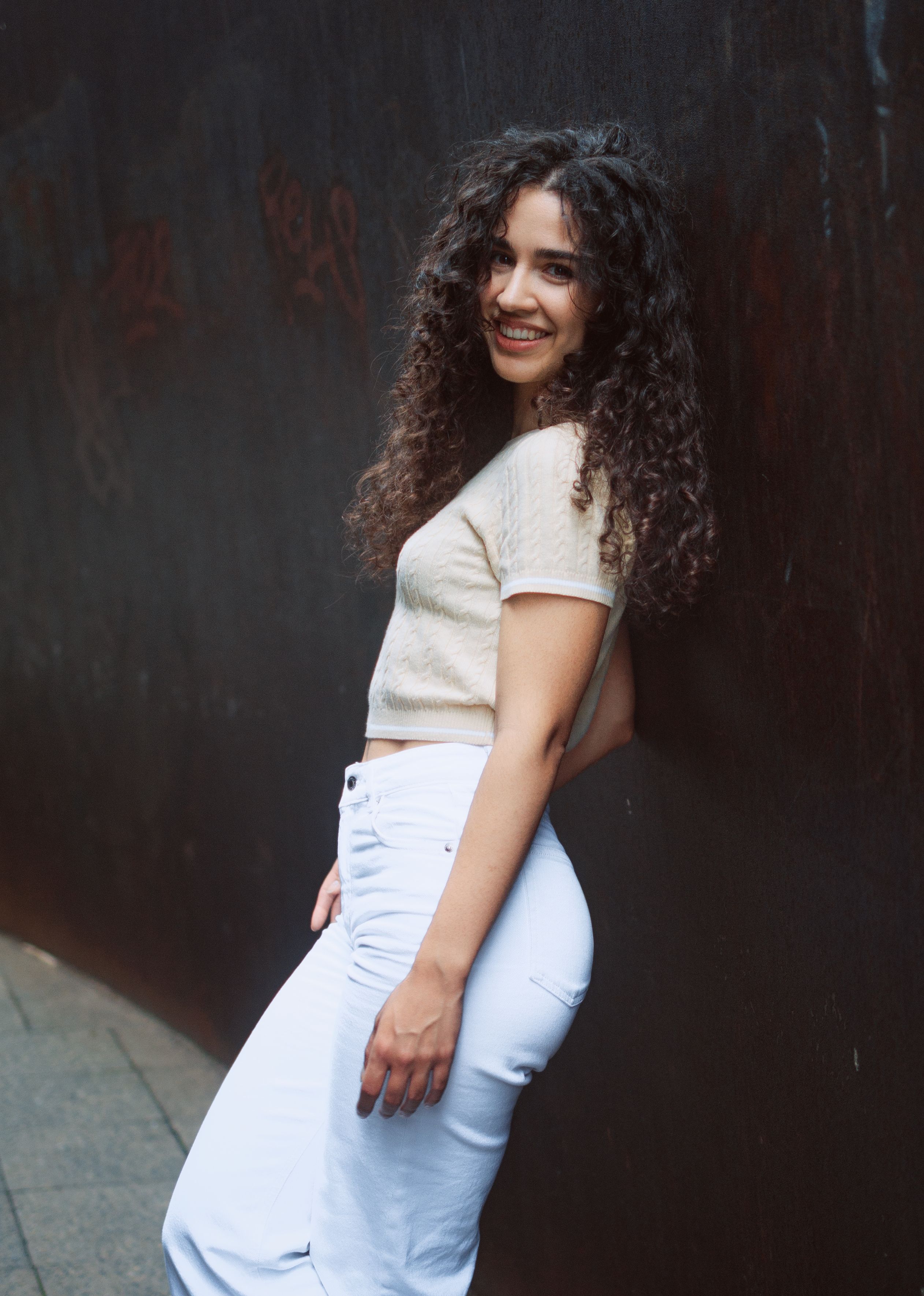 Portrait of a Woman with Curly Hair Outdoors · Free Stock Photo