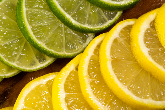 Detailed image of sliced lemons and limes showcasing vibrant colors and textures.