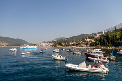 Free A picturesque bay in Herceg Novi, Montenegro, featuring boats and coastal hillside. Stock Photo