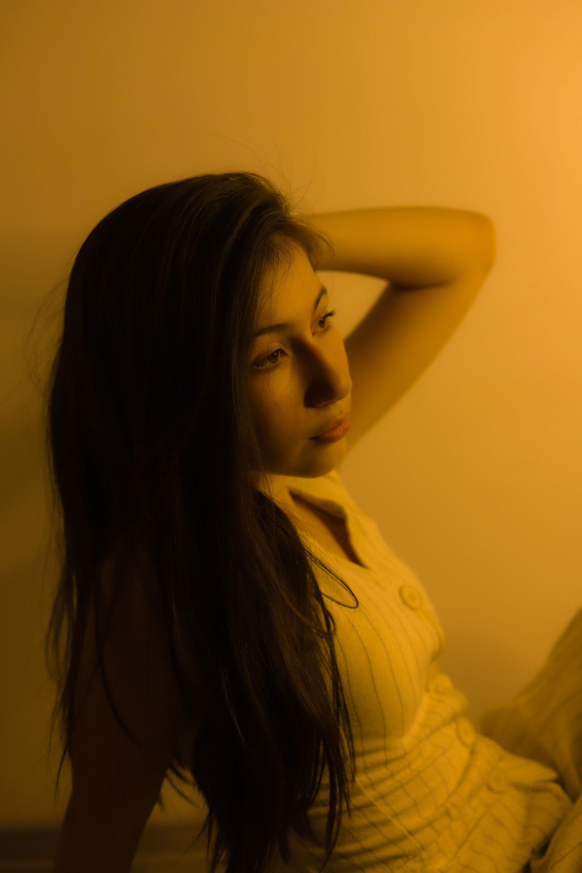 Woman with long healthy hair in warm natural light