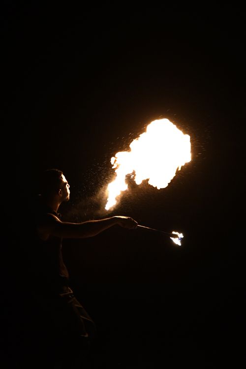 Free A captivating fire performer creating fiery patterns against the Dubai night sky. Stock Photo