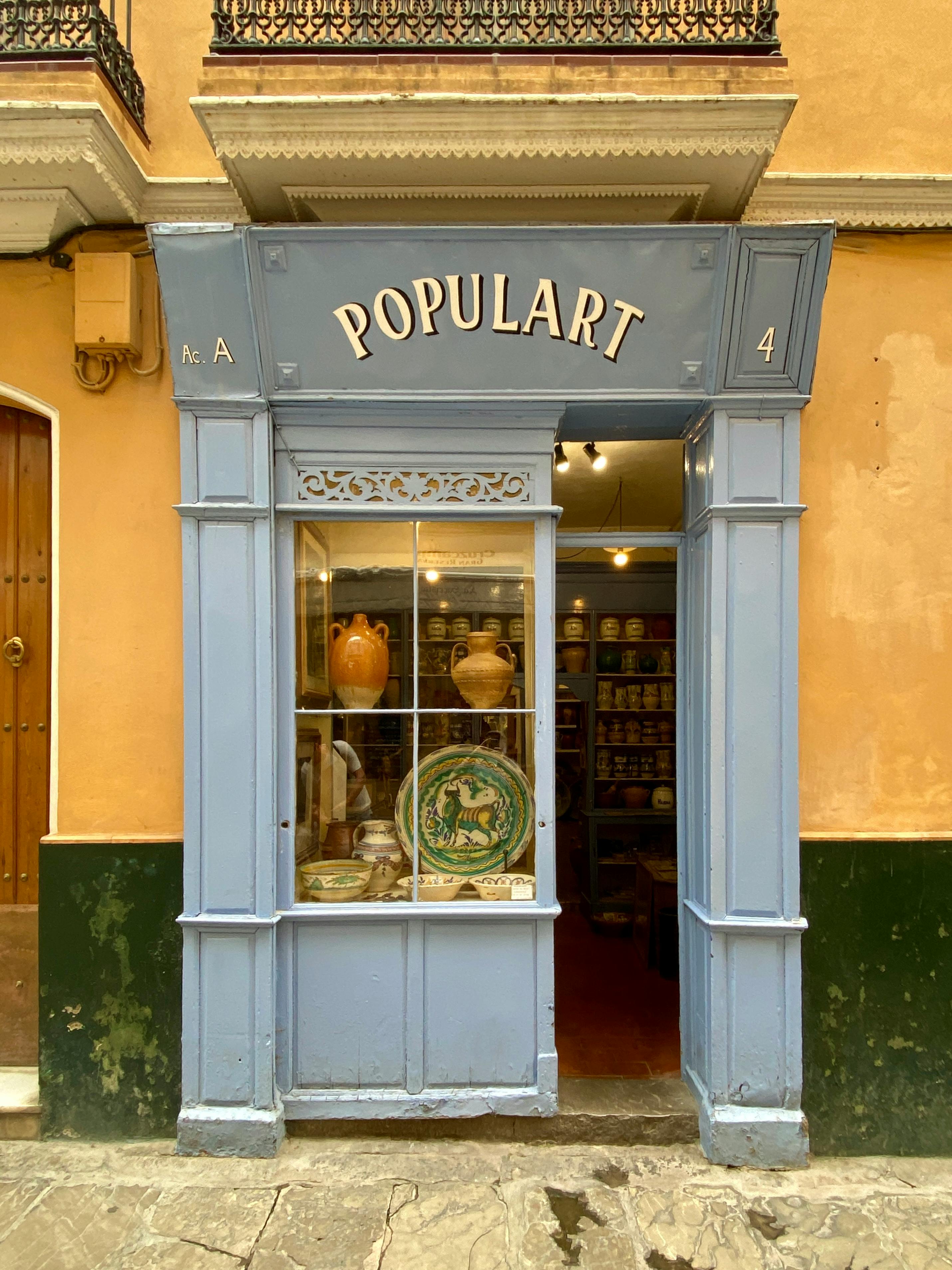 Discover the quaint charm of a ceramic shop in Seville, showcasing traditional pottery and crafts.