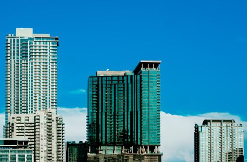 Free Tall modern skyscrapers in downtown Austin against a clear blue sky. Stock Photo