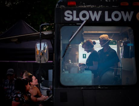 A candid moment at a food truck in Austin, Texas, capturing the essence of street food culture at night.