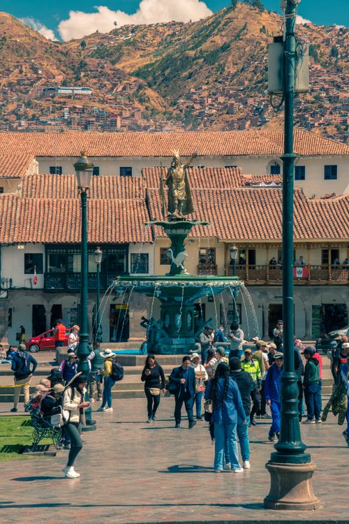 Free Tourists explore the historic Plaza de Armas in Cusco, Peru, on a sunny day. Stock Photo