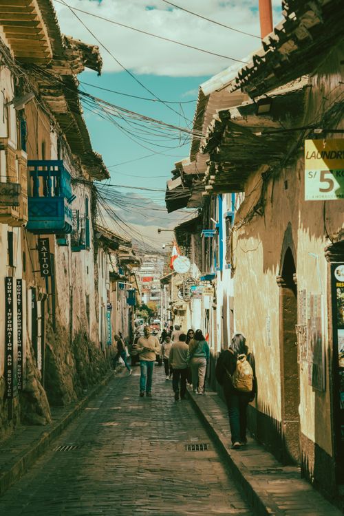 Free Bustling street scene in Cusco, Peru with people exploring the historic architecture. Stock Photo