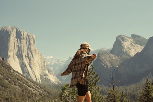 A woman enjoying nature in Yosemite National Park, capturing summer vibes and mountain landscapes.