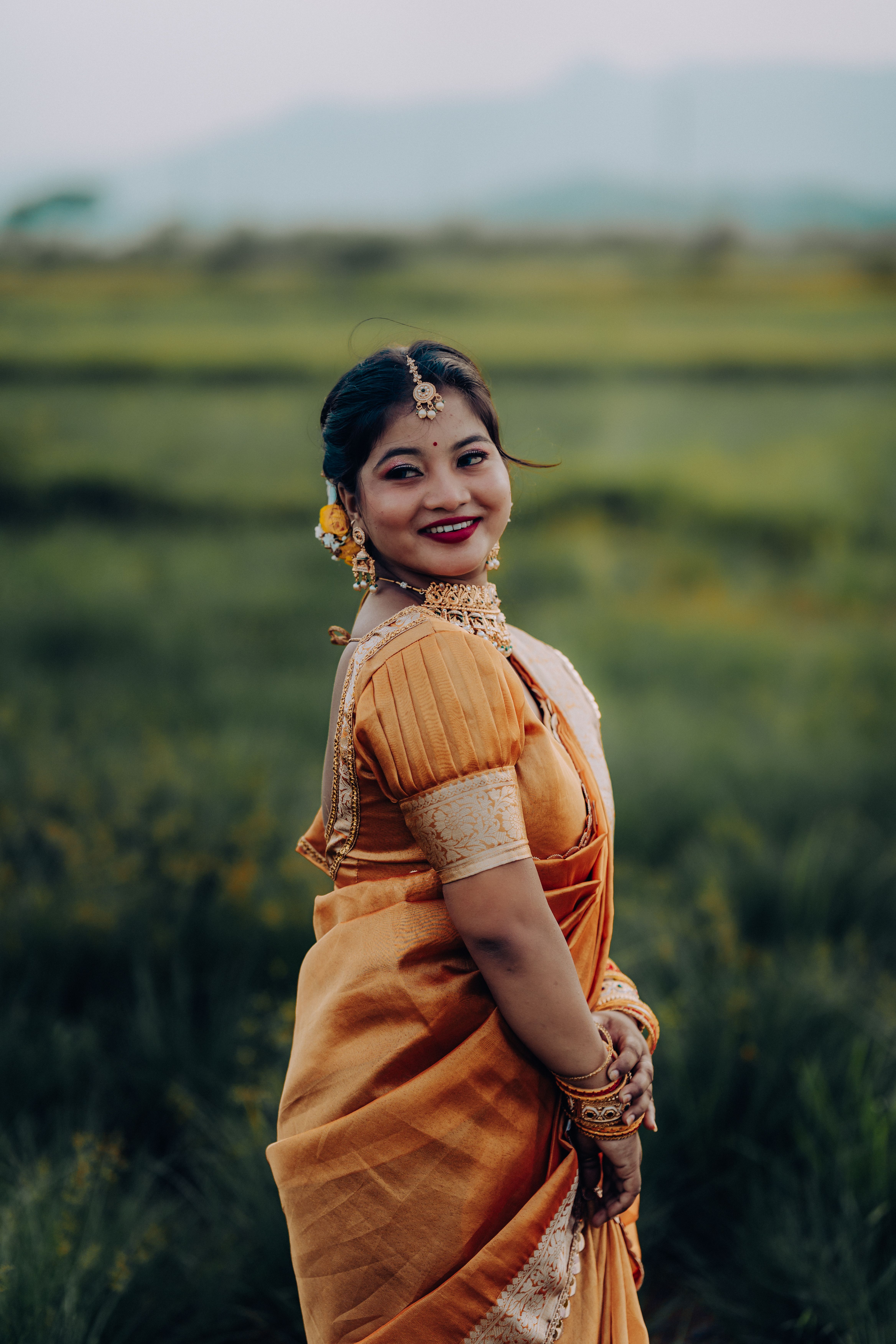 Elegant Indian Woman in Traditional Saree Outdoors · Free Stock Photo