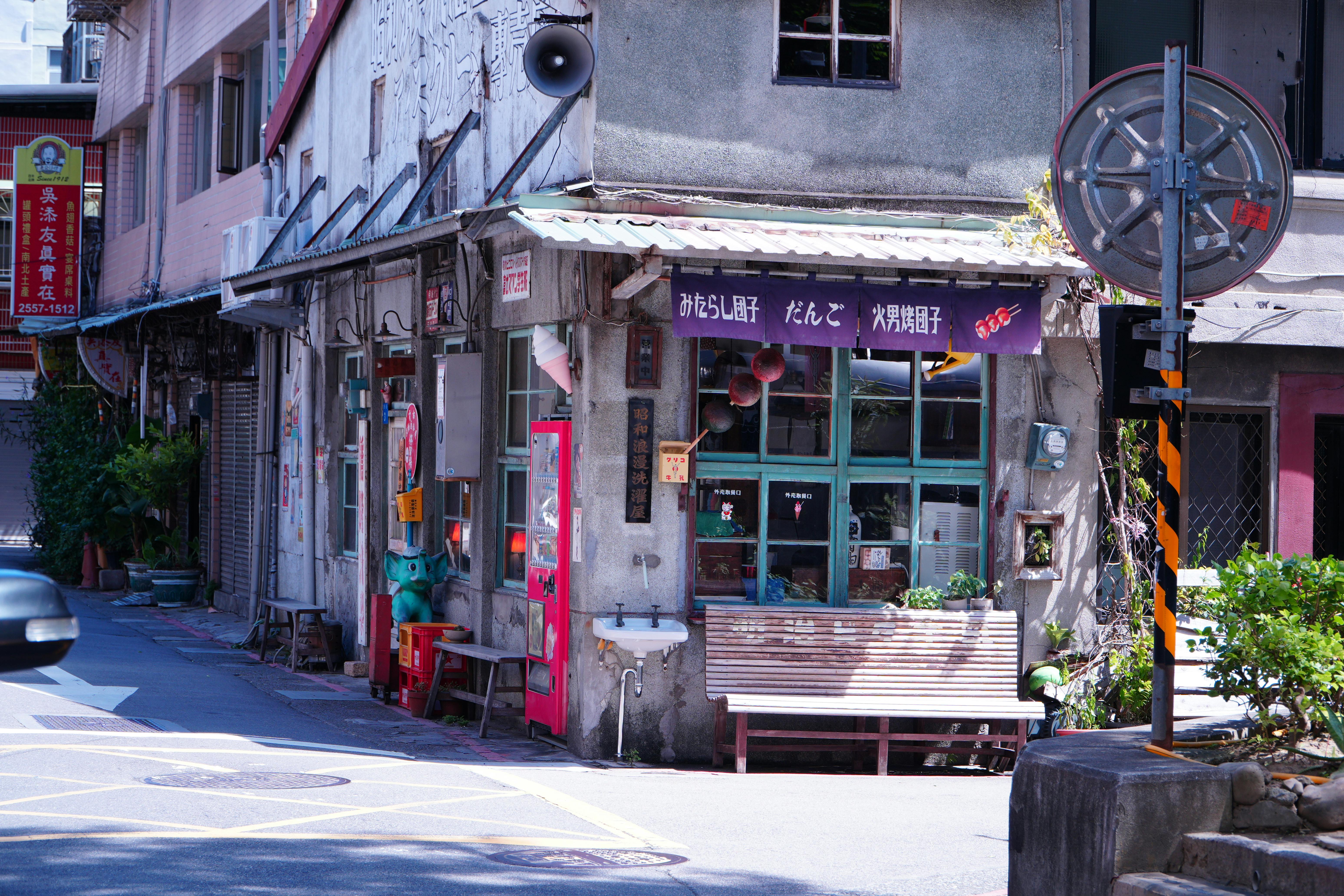 Explore a cozy street corner in Taipei's historic district, showcasing unique architecture and cultural charm.