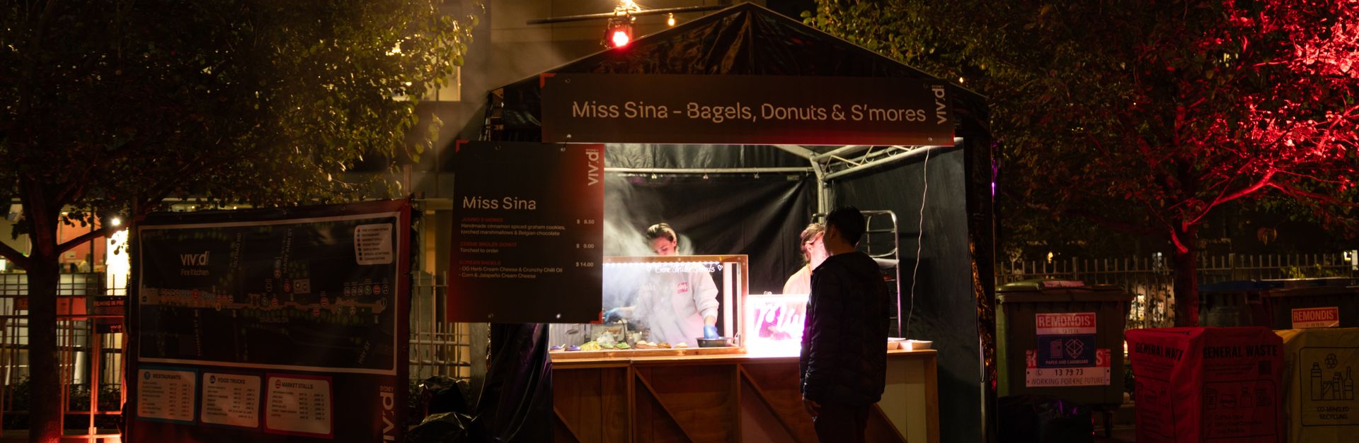 Street food stall during the Vivid Sydney Festival at night, capturing urban nightlife.