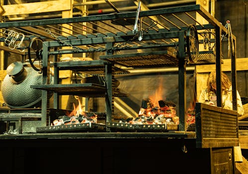 Close-up of a traditional barbecue grill with live coals and fire in Sydney, Australia.