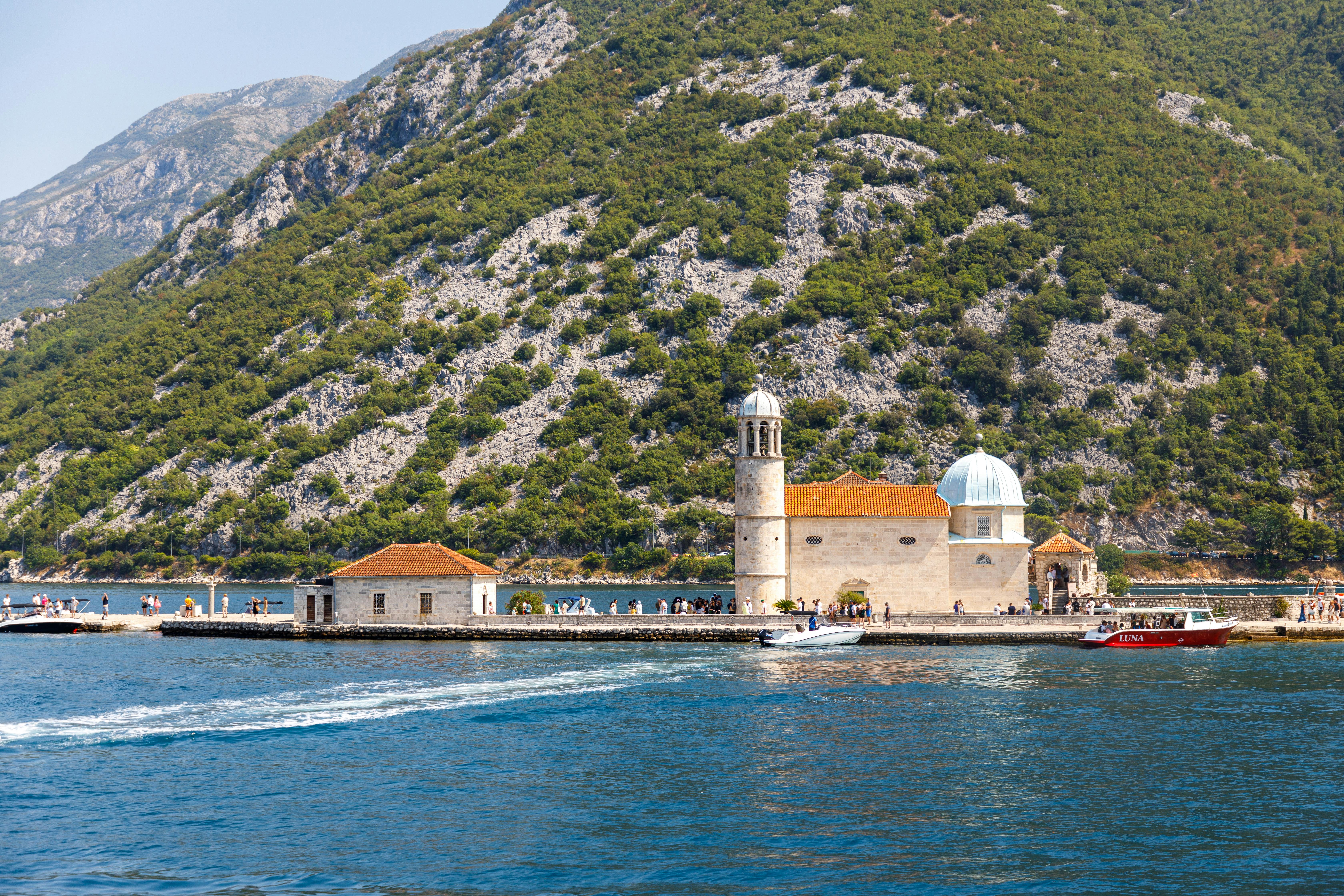 Scenic view of Saint George Island and Our Lady of the Rocks in Montenegro showcasing stunning natural and architectural beauty.