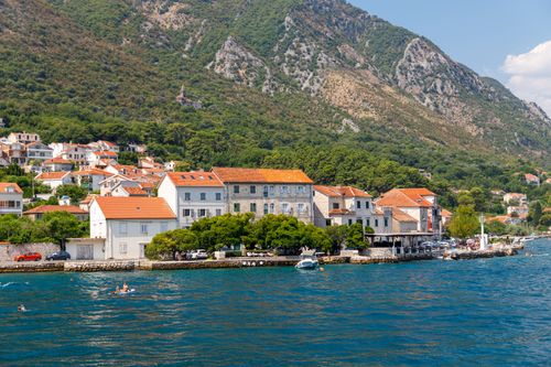 Free Scenic view of a picturesque coastal village with mountains and the Adriatic Sea. Stock Photo