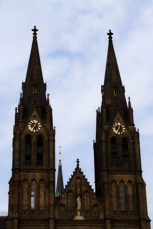 Free A stunning view of gothic church towers with clocks in Prague, Czechia. Stock Photo