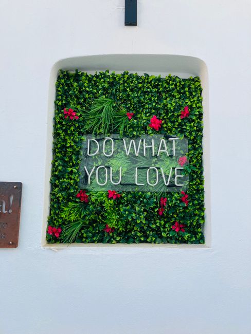 Decorative wall with 'Do What You Love' message in Naousa, Greece. Perfect for inspiration and motivation. Decorative wall with 'Do What You Love' message in Naousa, Greece. Perfect for inspiration and motivation.