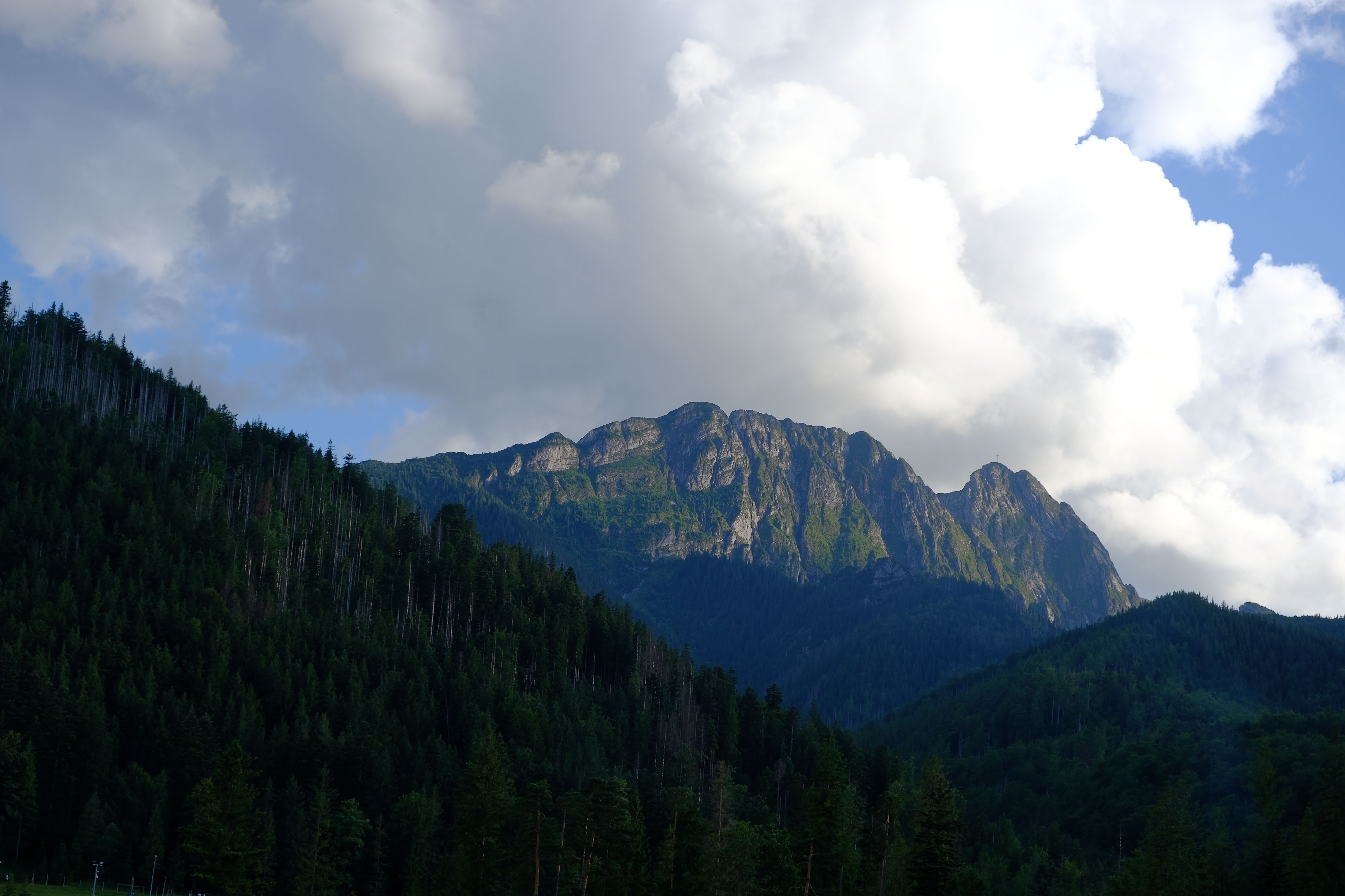 Breathtaking view of Vysoké Tatry mountains under dramatic clouds.