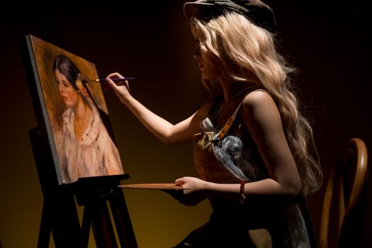 A female artist painting a classic portrait in a softly lit studio setting.