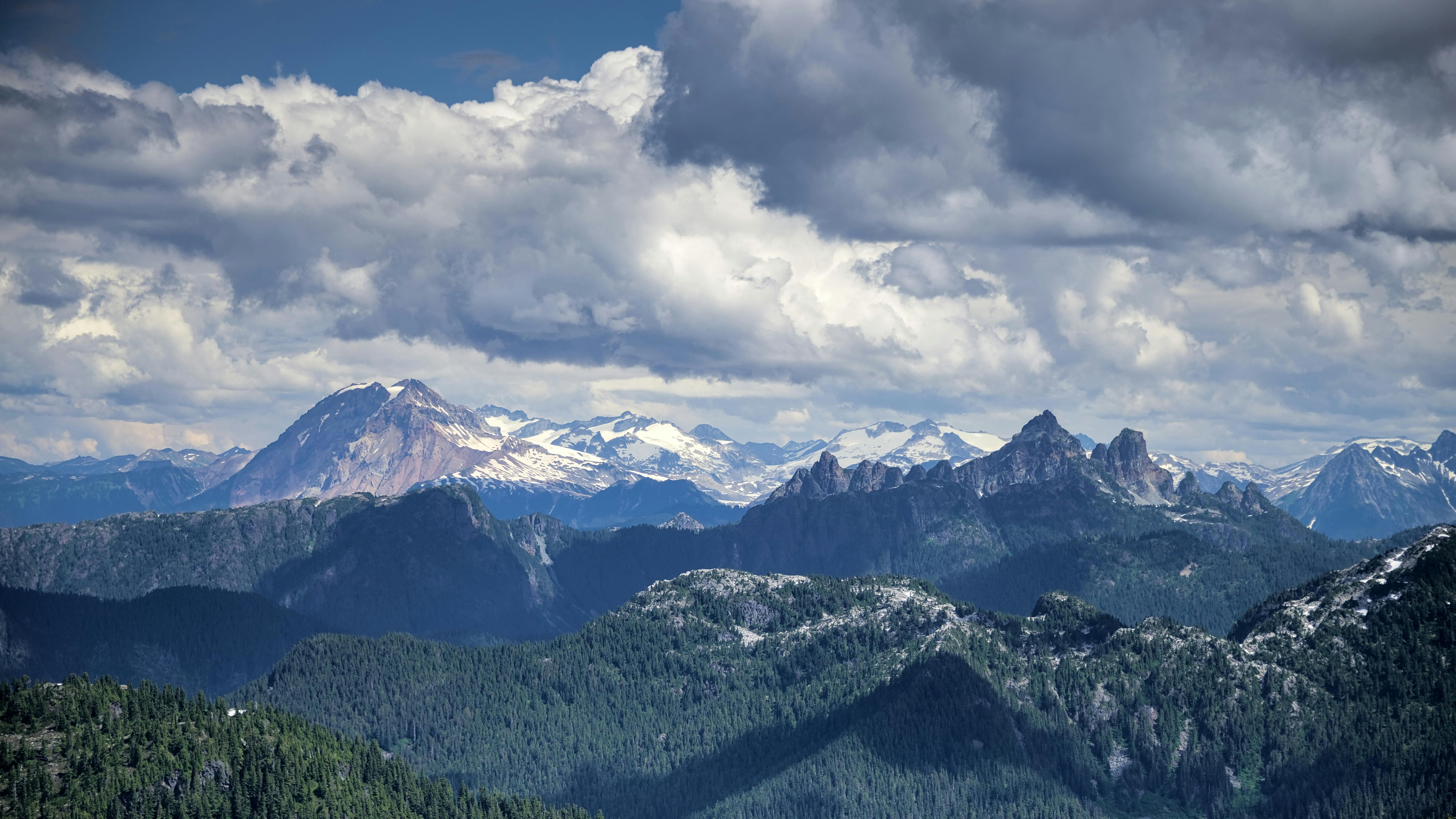 Breathtaking view of the Coast Mountains under dramatic clouds in British Columbia, Canada.