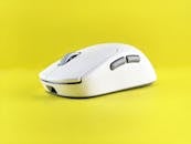 Sleek White Wireless Mouse on Yellow Background