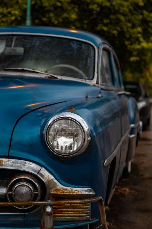 Free Close-up of a classic blue vintage car parked on a street in Mar del Plata, Argentina. Stock Photo